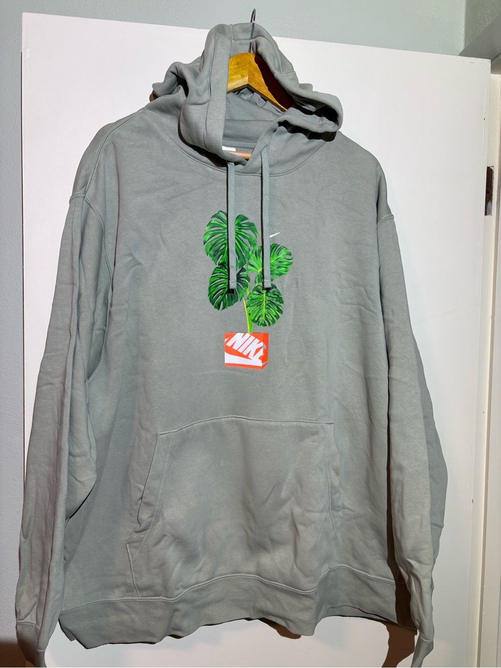 Nike Men’s sage green  Hoodie with Green Leaf Graphic and Orange Logo